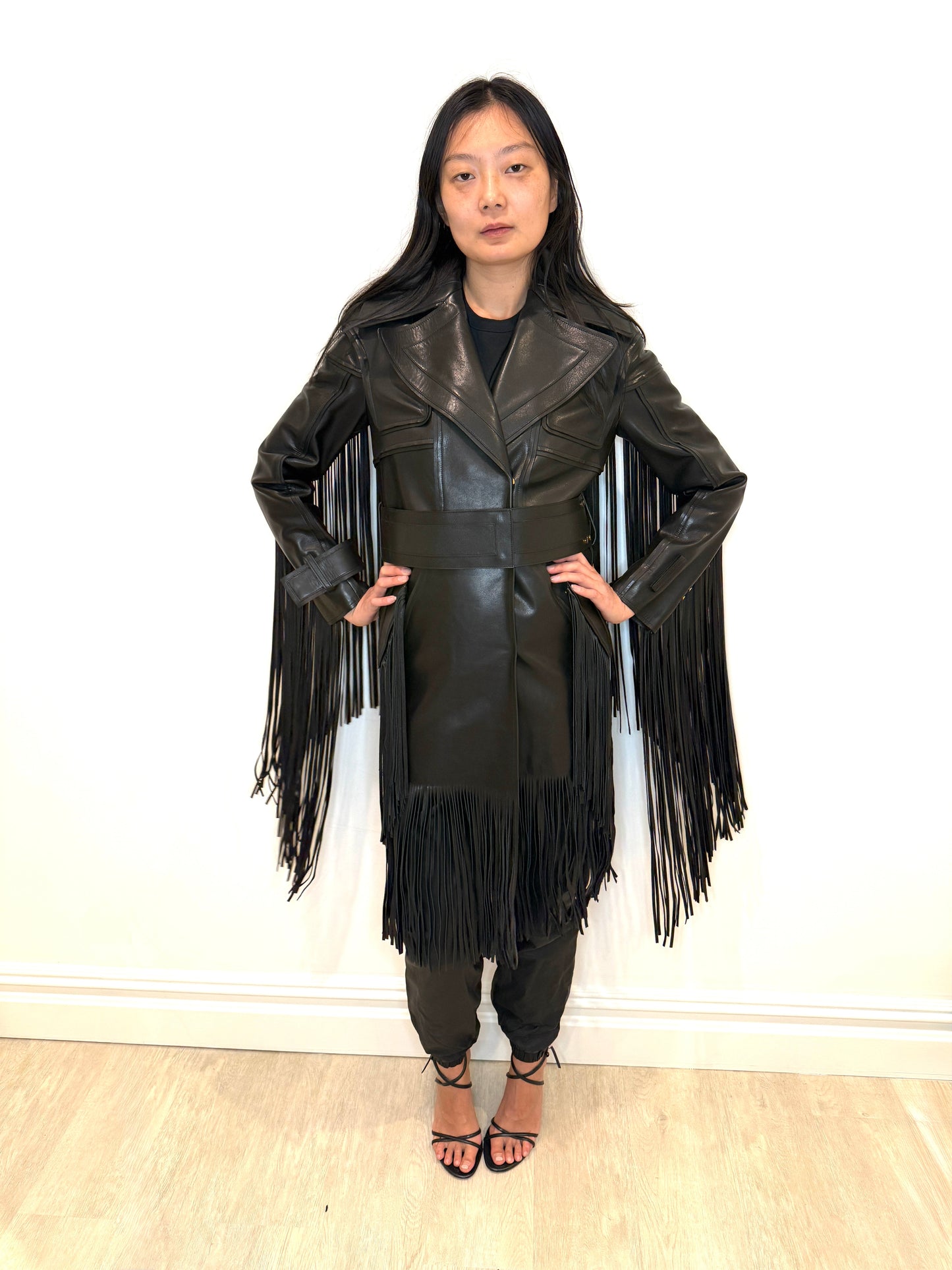 Rare Tom Ford full-length double-breasted leather jacket with fringe detailing on sleeves and back.